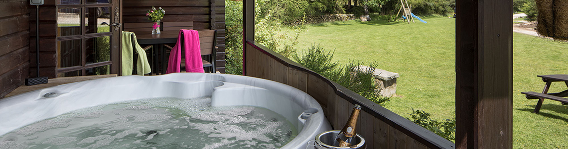 Enjoy a drink and relax in one of our hot tubs